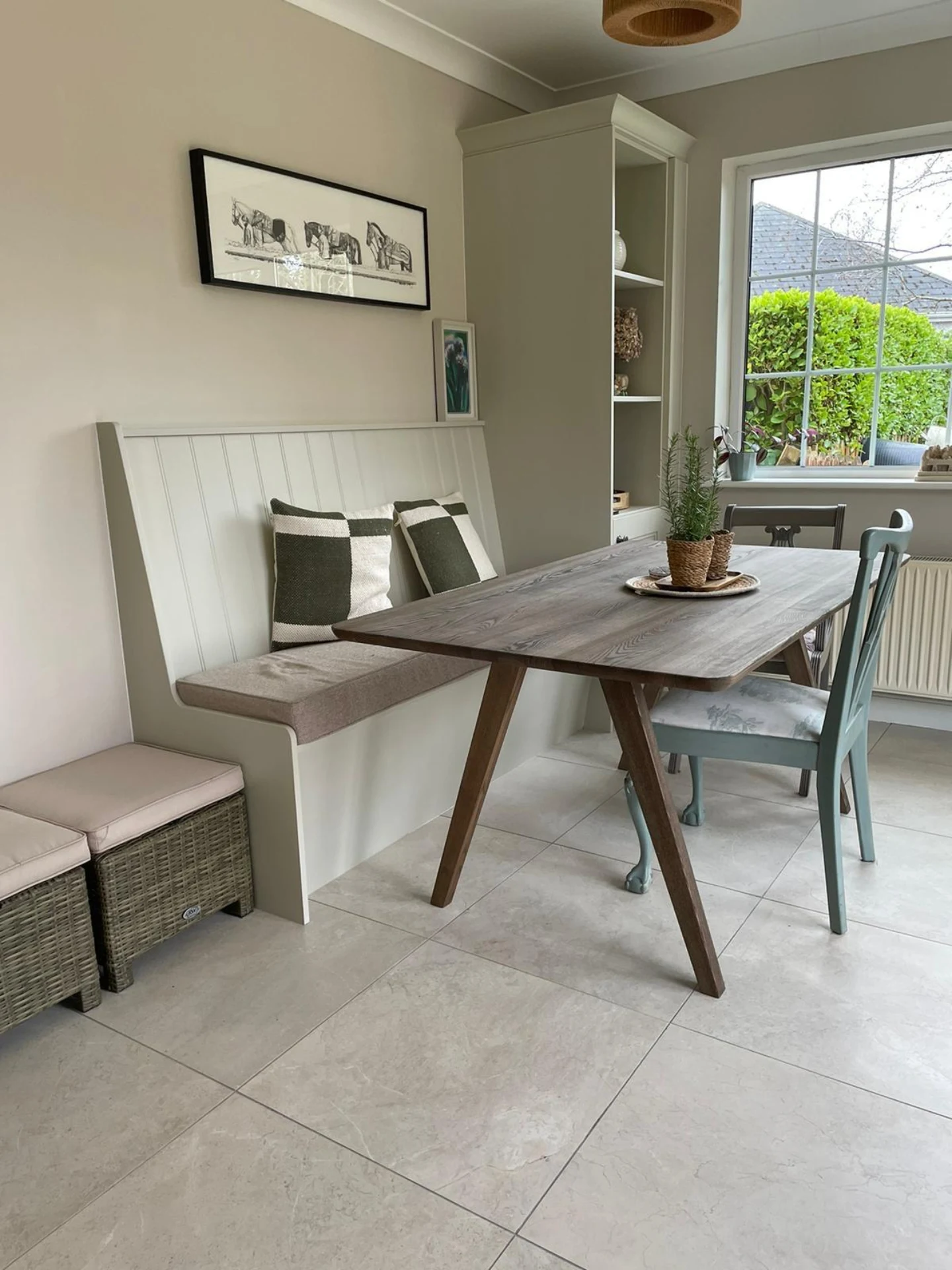 Dining bench window seat with fitted storage drawers beneath.